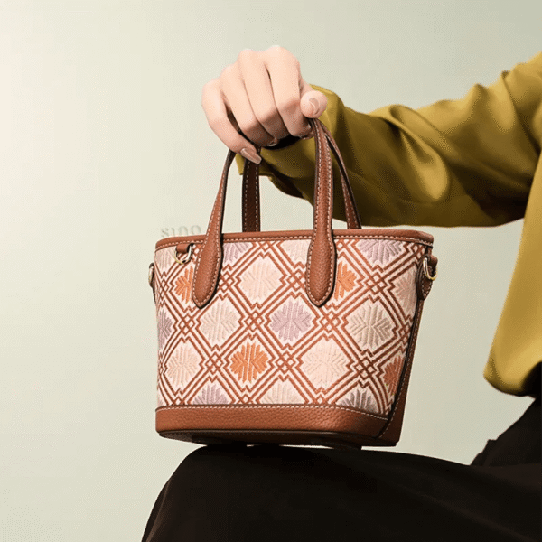 luxury-zhuang-brocade-embroidered-leather-zipper-crossbody-bag-model-sitting-knee-handheld luxury-zhuang-brocade-embroidered-leather-zipper-crossbody-bag-model-sitting-knee-handheld