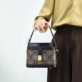 model-holding-song-brocade-bag-front