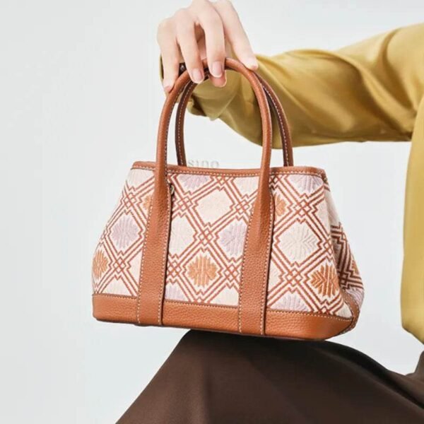 zhuang-brocade-chrysanthemum-crossbody-bag-model-sitting-knee zhuang-brocade-chrysanthemum-crossbody-bag-model-sitting-knee